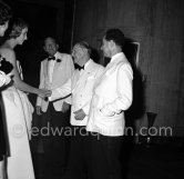 Marella Caracciolo di Castagneto, wife of Gianni Agnelli, Somerset Maugham and his secretary and companion Alan Searle (right) and Noel Coward at the UN Refugees children charity gala at the Sporting d’Eté, Monte Carlo 1954. - Photo by Edward Quinn