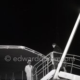 American gossip columnist Elsa Maxwell getting on board Onassis' yacht Christina. Monaco harbor 1954. - Photo by Edward Quinn