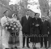 Simone Signoret, French actress often hailed as one of France’s greatest movie stars, on her wedding in 1951 to actor and singer Yves Montand. At the same restaurant Colombe d’Or, Saint-Paul-de-Vence, where their romance began. Jacques Prévert far right. - Photo by Edward Quinn