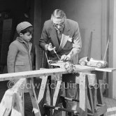 Aristotle Onassis with his son Alexander at Château de la Croë. He seems to be preparing his son's toy car. Cap d’Antibes 1954. - Photo by Edward Quinn