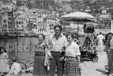 Gregory Peck with two female admirers at the
harbor in Villefranche-sur-Mer, where he was on location, playing the leading role in Captain Horatio Hornblower, Villefranche s/Mer 1950 - Photo by Edward Quinn