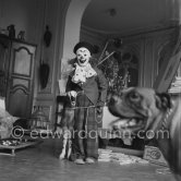 Claude Picasso dressed up as a clown, Paloma Picasso as a trapper. With goat Esmeralda and boxer dog Jan. La Californie, Cannes 1956. - Photo by Edward Quinn
