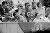 At the bullfight. For once Lucia Bosè, wife of Dominguin, can smile at a bullfight, her husband is not in the arena. From left: Pablo Picasso, Luis Miguel Dominguin (spectator because of injuries), Lucia Bosè, Jacqueline, second row chauffeur Jeannot, Catherine Hutin. Corrida des vendanges. Arles 1959. - Photo by Edward Quinn