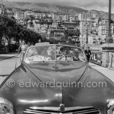 Katy Jurado and not yet identified person, actors in "The Racers", persecuted by autograph hunters. Monte Carlo 1955. Car: 1950 Simca 8 Sport cabriolet - Photo by Edward Quinn
