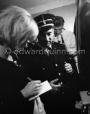 Sylvie Vartan signing autographs, Johnny Halliday in the background, before a concert in their wardrobe at Casino Municipal. Nice 1964. - Photo by Edward Quinn