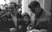 Luchino Visconti (left) and Burt Lancaster signing autographs. Cannes 1956. - Photo by Edward Quinn