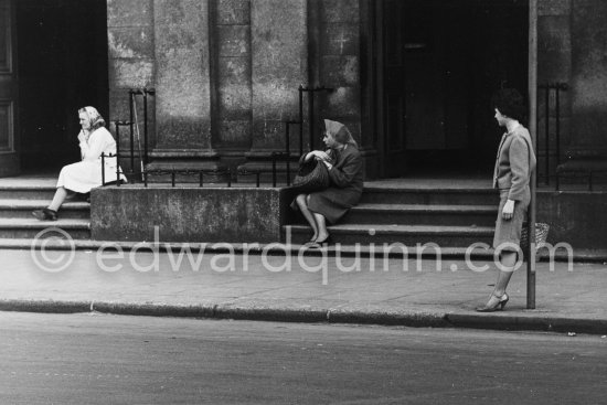 Three women waiting at the bus stop. Dublin 1963. - Photo by Edward Quinn