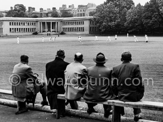 The cricket pitch in the grounds of Trinity College. Dublin 1963. Published in Quinn, Edward. James Joyces Dublin. Secker & Warburg, London 1974. - Photo by Edward Quinn
