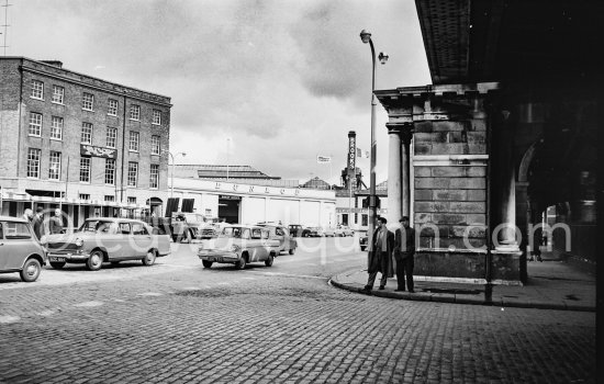 Under the railroad, near custom House (?). Dublin 1963. Cars: Morris Oxford Series V, Ford Anglia 105E - Photo by Edward Quinn