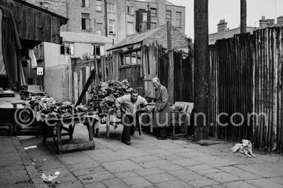 Leather stall. Anglesea Market, Dublin\'s secondhand market in a laneway off Moore Street. Dublin 1963. - Photo by Edward Quinn