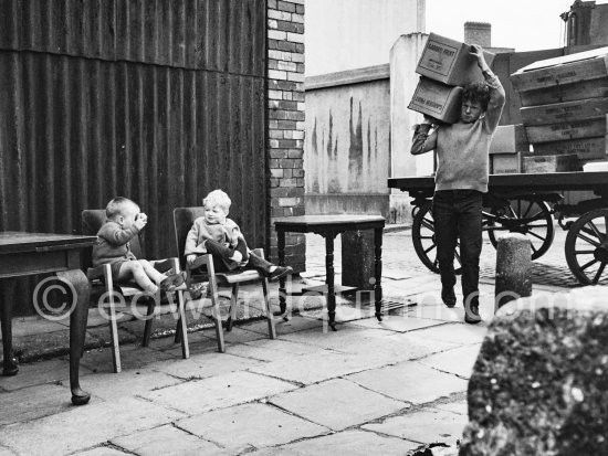 Boys at Anglesea Market, Dublin\'s secondhand market in a laneway off Moore Street. Dublin 1963. - Photo by Edward Quinn