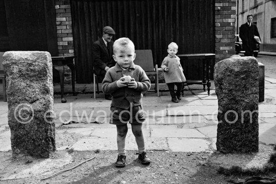 Boy at Anglesea Market, Dublin\'s secondhand market in a laneway off Moore Street. Dublin 1963. - Photo by Edward Quinn