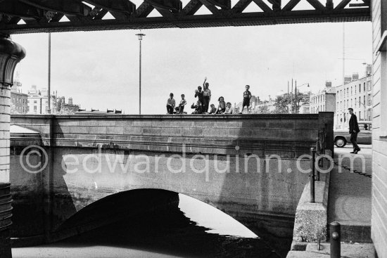The Loop Line railroad Bridge above and just behind it children on Butt Bridge. Dublin 1963. - Photo by Edward Quinn