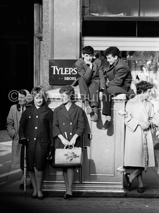 Waiting for President Kennedy to drive past during his visit. Dublin 1963. - Photo by Edward Quinn