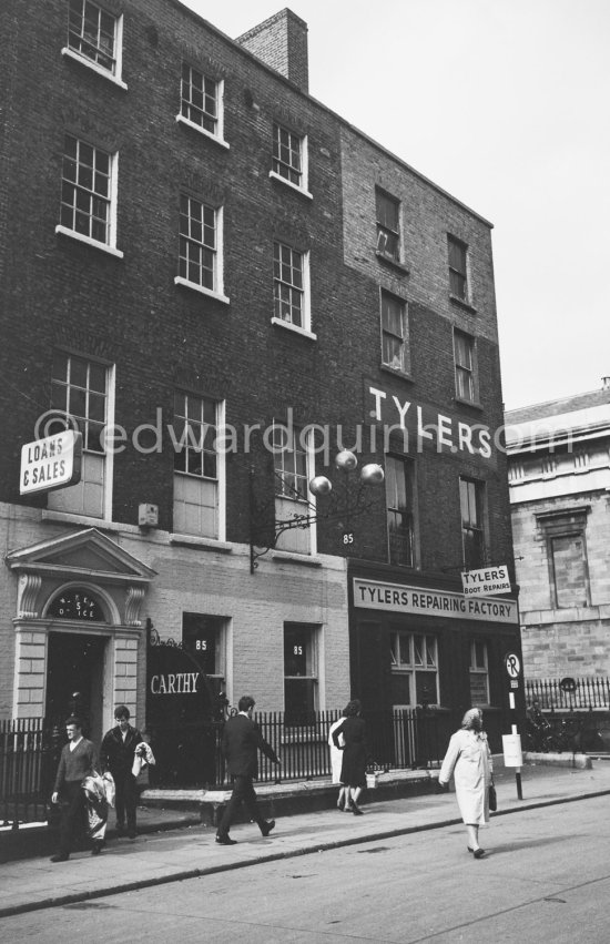 A pawn shop (The Three Balls) with the typical sign beside the St Marys Pro-Cathedral Marlborough Street. Tylers was a shoe shop chain. Dublin 1963. - Photo by Edward Quinn