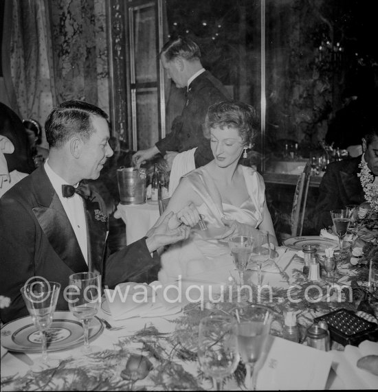 Gianni Agnelli\'s wife, Marella, Princess Caracciolo, and not yet identified person. New Year’s Eve dinner. Monte Carlo 1953. - Photo by Edward Quinn