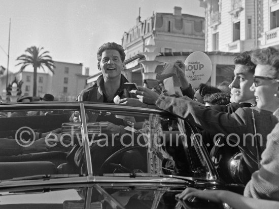 Jean-Pierre Aumont, French actor. Cannes Film Festival on Croisette. Cannes 1954. Car: Oldsmobile Futuramic 88 1950 - Photo by Edward Quinn