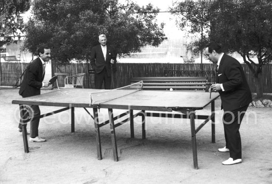 Charles Aznavour playing Ping Pong with singer Dario Moreno. Cannes 1960. - Photo by Edward Quinn