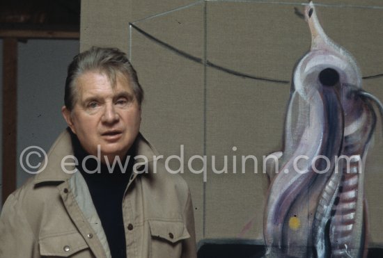 Francis Bacon with the painting "Carcass of Meat and Bird of Prey" at his Reece Mews studio in London 1980. - Photo by Edward Quinn