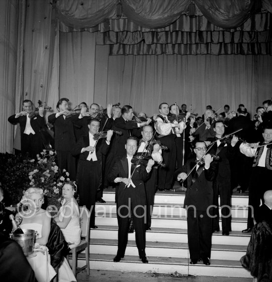 Bal de la Rose gala dinner at the International Sporting Club. Bandleader Louis Frosio (left). Monte Carlo, 1955. - Photo by Edward Quinn