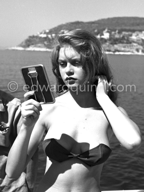 Brigitte Bardot during filming of Manina, la fille sans voiles on the  yacht Suraya. Villefranche harbor 1952.