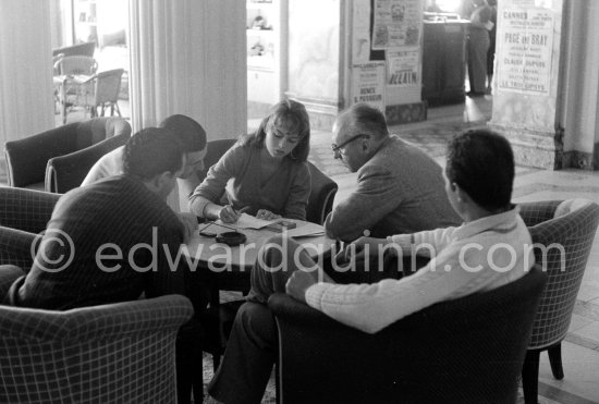 Brigitte Bardot negotiates a contract at the Hotel Negresco, Nice 1955. - Photo by Edward Quinn
