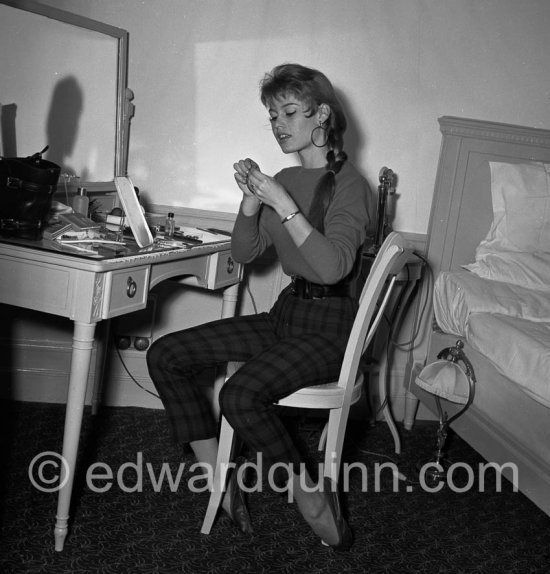 Brigitte Bardot in her room at the Hotel Negresco. With a portable radio. Nice 1955. - Photo by Edward Quinn