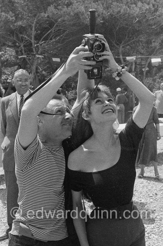 Brigitte Bardot with a photographer\'s Rolleiflex. Cannes Film Festival 1956. - Photo by Edward Quinn