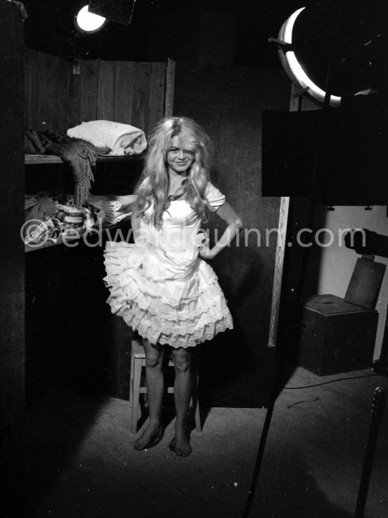 Brigitte Bardot in her wardrobe during filming of the last scenes of "Les Bijoutiers du clair de lune" ("The Night Heaven Fell"), on the grounds of the Studios de la Victorine in Nice. Directing the film is Brigitte’s ex-husband Roger Vadim. Nice 1958. - Photo by Edward Quinn