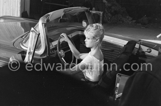 Brigitte Bardot. Studios de la Victorine, during filming of "Voulez-vous danser avec moi?" ("Come dance with me"). Nice 1959. Car: Ford Fairlane 500 Sunliner Convertible 1957. - Photo by Edward Quinn