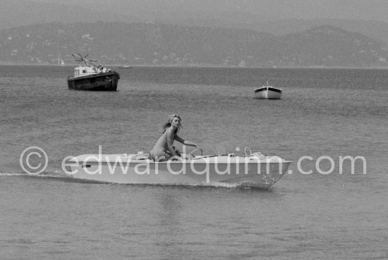 Brigitte Bardot on a speed boat near her home "La Madrague". Saint-Tropez 1961. - Photo by Edward Quinn