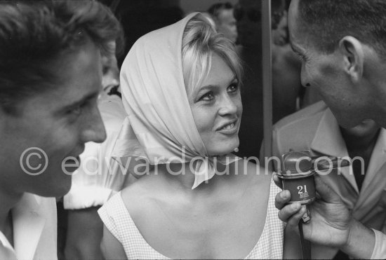 Brigitte Bardot interviewed for radio. Sacha Distel on the left. Saint-Tropez 1958. - Photo by Edward Quinn