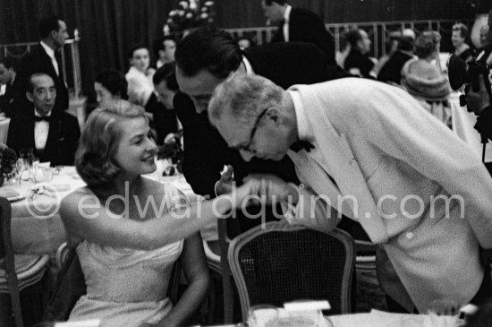 A gentleman greeting Ingrid Bergman at a gala dinner during the Cannes Film Festival 1956. - Photo by Edward Quinn