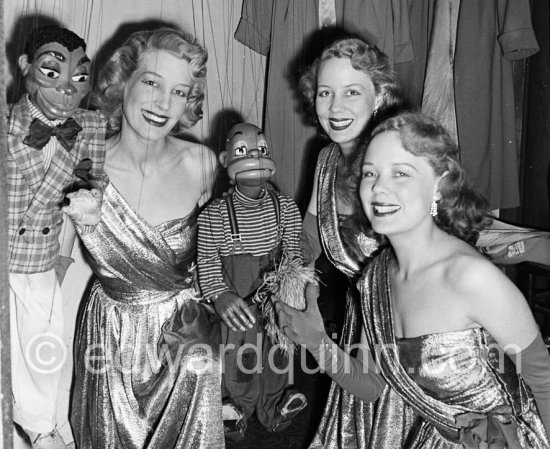 THE BEVERLEY SISTERS in her wardrobe, probably in a theatre in Soho, London 1950. They were the most popular, highest-earning female entertainers in the UK in the 1950s. - Photo by Edward Quinn