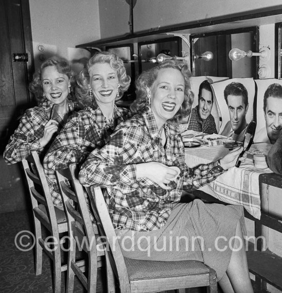 THE BEVERLEY SISTERS in her wardrobe, probably in a theatre in Soho, London 1950. They were the most popular, highest-earning female entertainers in the UK in the 1950s. - Photo by Edward Quinn