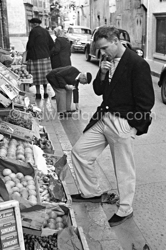 In 1954 Marlon Brando came to Bandol, a small town near Toulon, to visit his fiancée Josanne Mariani-Bérenger, daughter of a fisherman. Brando liked Bandol, as nobody really knew who he was. At first he refused to be photographed, but later he came out for a walk along the harbor and even smiled when he saw the photographer. Brando announced his engagement to the press, however the love affair ended abruptly when he returned to America. Bandol 1954. - Photo by Edward Quinn