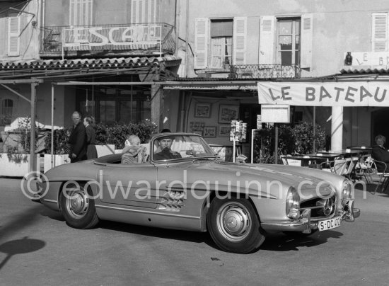 Yul Brynner holidaying in a secret hide out with his wife on the Riviera. Saint-Tropez 1959. Car: 1959 Mercedes-Benz 300 SL Roadster. - Photo by Edward Quinn