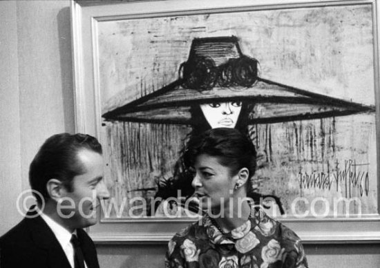 Bernard Buffet and his wife Annabel with one of his paintings. Cannes 1960. - Photo by Edward Quinn