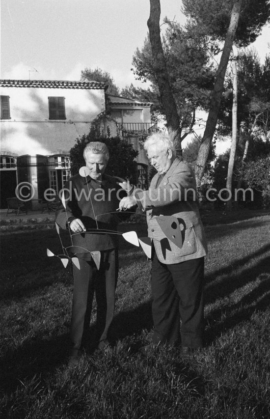 Alexander Calder presents one of his mobiles to art dealer and collector Aimé Maeght. Saint-Paul-de-Vence, 1961. - Photo by Edward Quinn