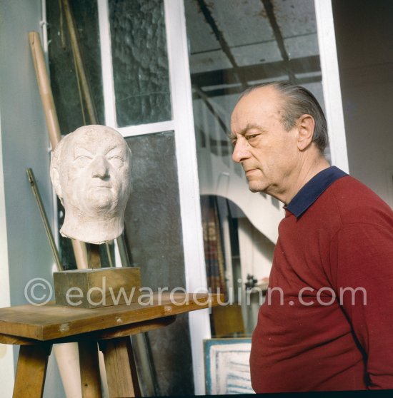 Massimo Campigli with his portrait by Marino Marini at his studio in Saint-Tropez 1964. - Photo by Edward Quinn