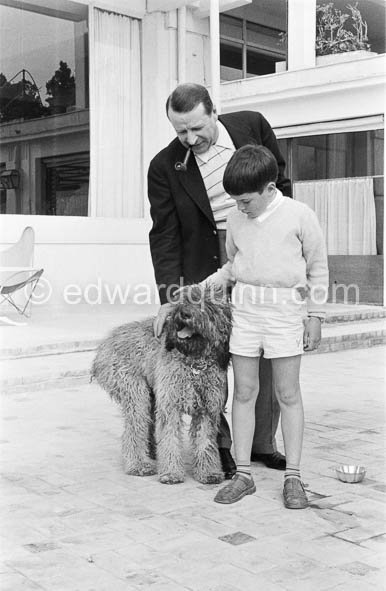 Georges Simenon with his poodle Mister and Charlie Chaplin's son Michael at his villa Golden Gate. Cannes 1955. - Photo by Edward Quinn