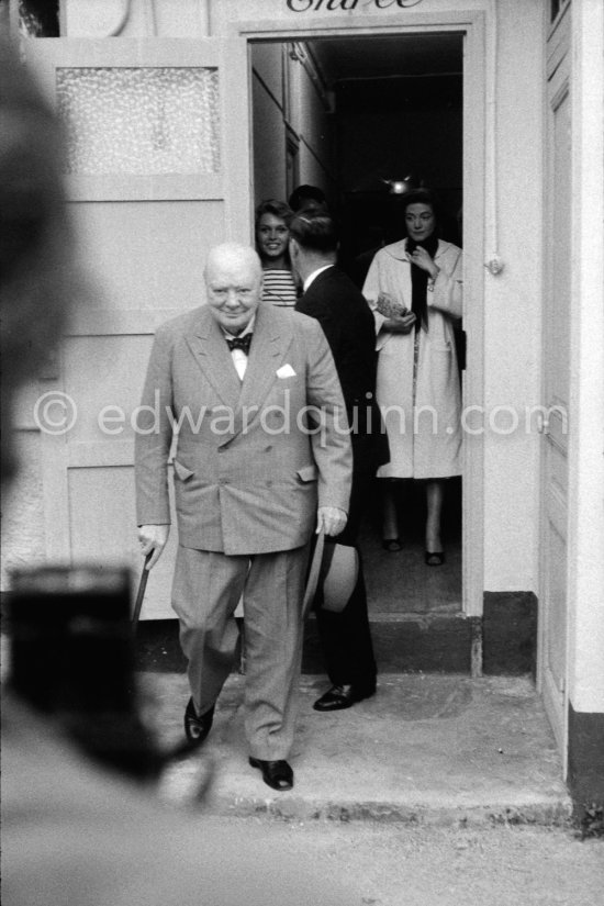 Sir Winston Churchill, Brigitte Bardot in the background. Studios de la Victorine, Nice 1956. - Photo by Edward Quinn