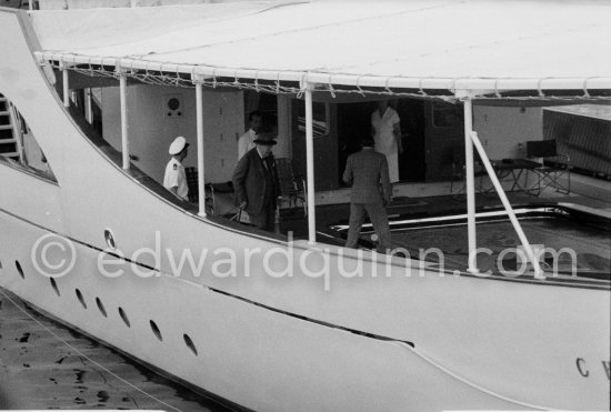 Aristotle Onassis and Sir Winston Churchill. On board Christina, Churchill sitting in lowerable swimming pool. Monaco harbor, about 1957. - Photo by Edward Quinn