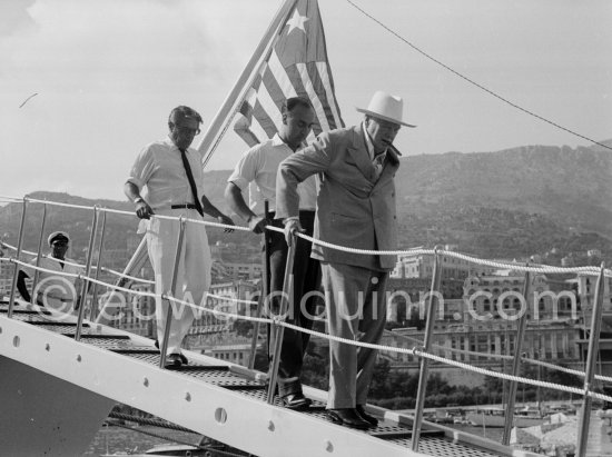 Onassis and Sir Winston Churchill leaving Onassis\' yacht Christina. Monaco harbor 1959 - Photo by Edward Quinn