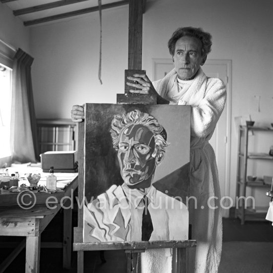 Jean Cocteau at Villa Santo Sospir posing with his "Autoportrait à la veste". Saint-Jean-Cap-Ferrat 1952. - Photo by Edward Quinn