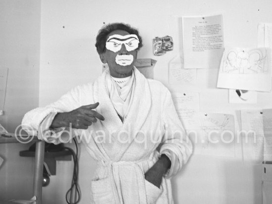 Jean Cocteau at his apartement at Villa Santo Sospir with a mask he made from cut-out paper and designs sketched in with pencil. Saint-Jean-Cap-Ferrat 1952. - Photo by Edward Quinn