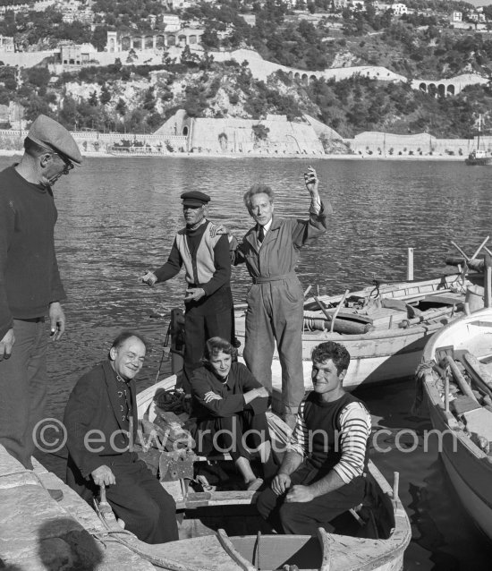 Jean Cocteau with fishermen at the time when he was working on his mural in the Chapelle Saint Pierre. Villefranche-sur-Mer 1956. - Photo by Edward Quinn