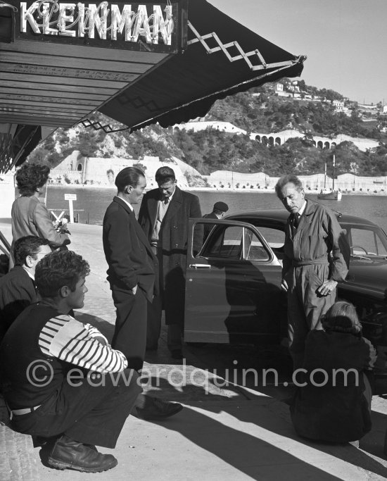 Jean Cocteau with fishermen and officials at the time when he was working on his mural in the Chapelle Saint Pierre. Villefranche-sur-Mer 1956 - Photo by Edward Quinn