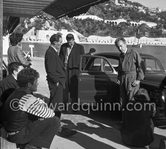 Jean Cocteau with fishermen and officials at the time when he was working on his mural in the Chapelle Saint Pierre. Villefranche-sur-Mer 1956. - Photo by Edward Quinn