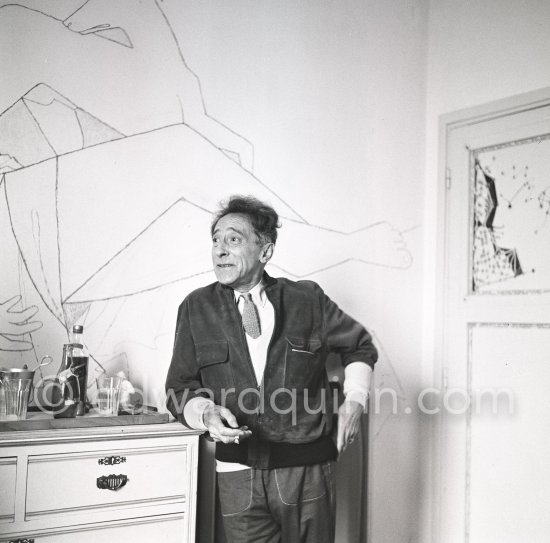 Jean Cocteau at Villa Santo Sospir of his close friend Francine Weisweiller in front of one of the murals he made for the interior walls. Saint-Jean-Cap-Ferrat 1954. - Photo by Edward Quinn